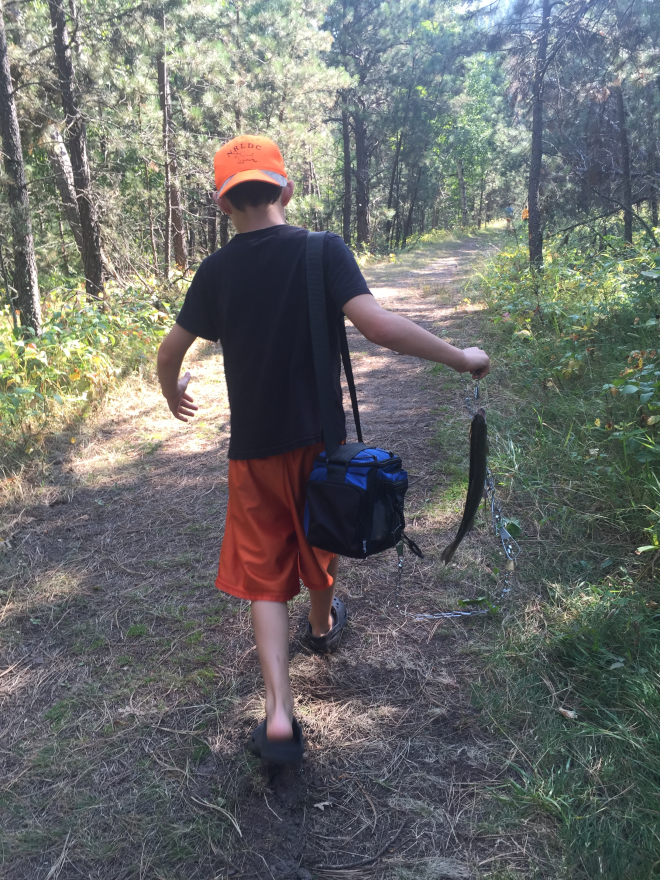 Sam carrying our rainbow trout.